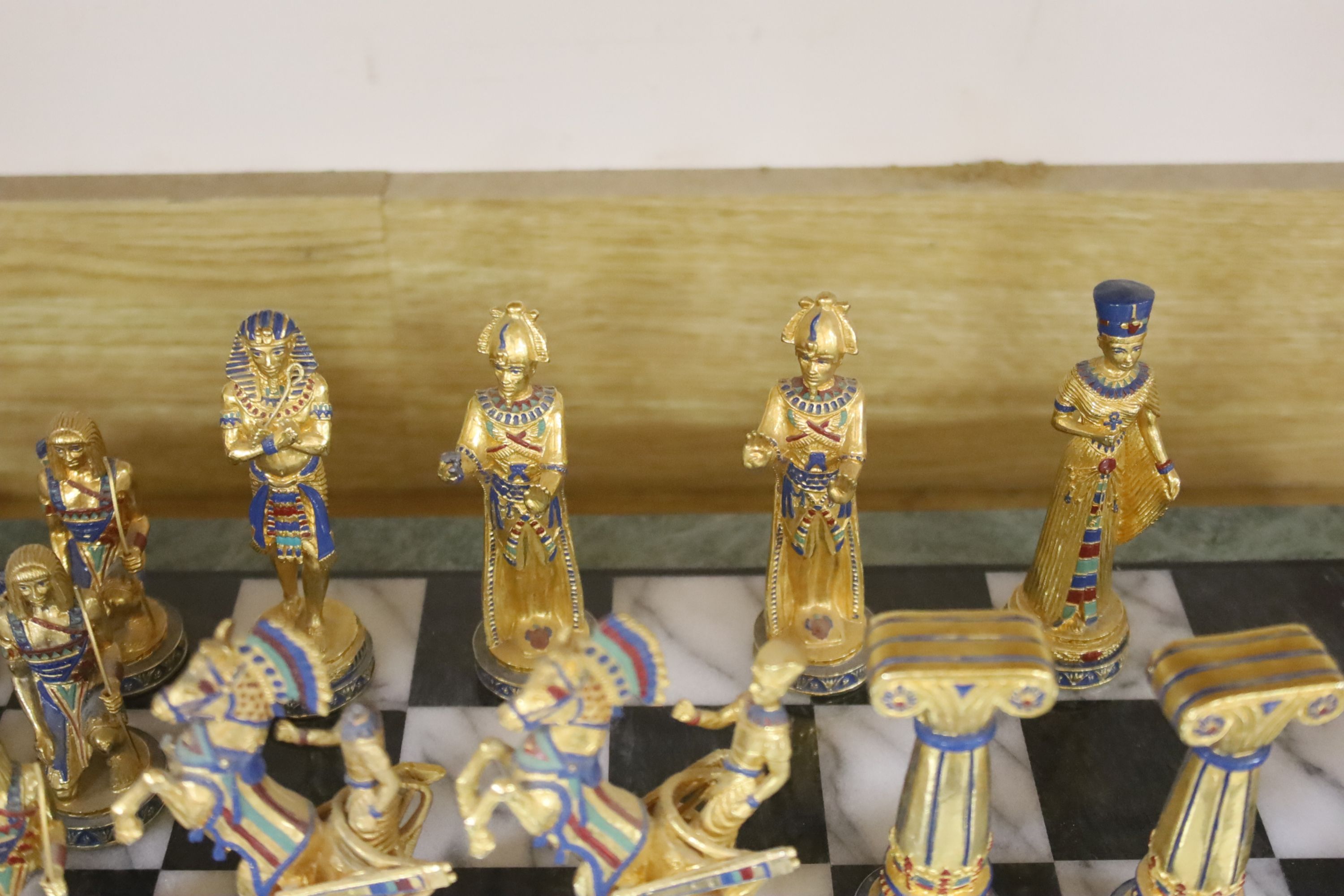 A contemporary chess board and pieces, Egyptian theme